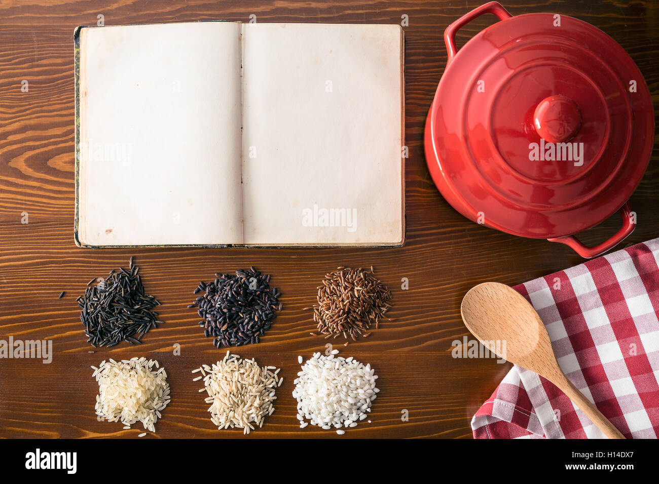 Blank cookbook and different rice varieties. Top view Stock Photo Alamy