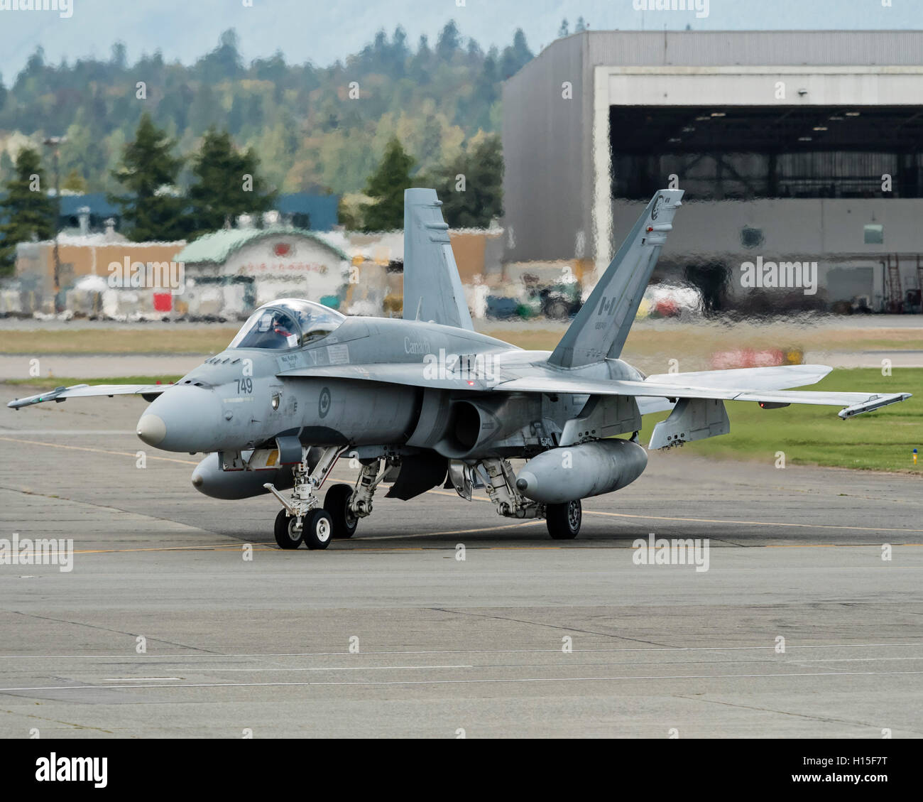 CF-18A Hornet fighter jet of the Royal Canadian Air Force taxies along the tarmac at Vancouver International Airport, Canada Stock Photo
