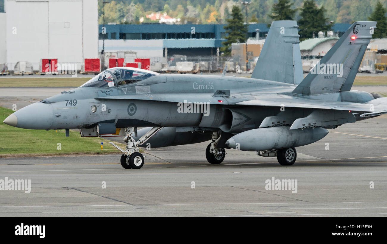 CF-18A Hornet fighter jet of the Royal Canadian Air Force taxies along the tarmac at Vancouver International Airport, Canada Stock Photo