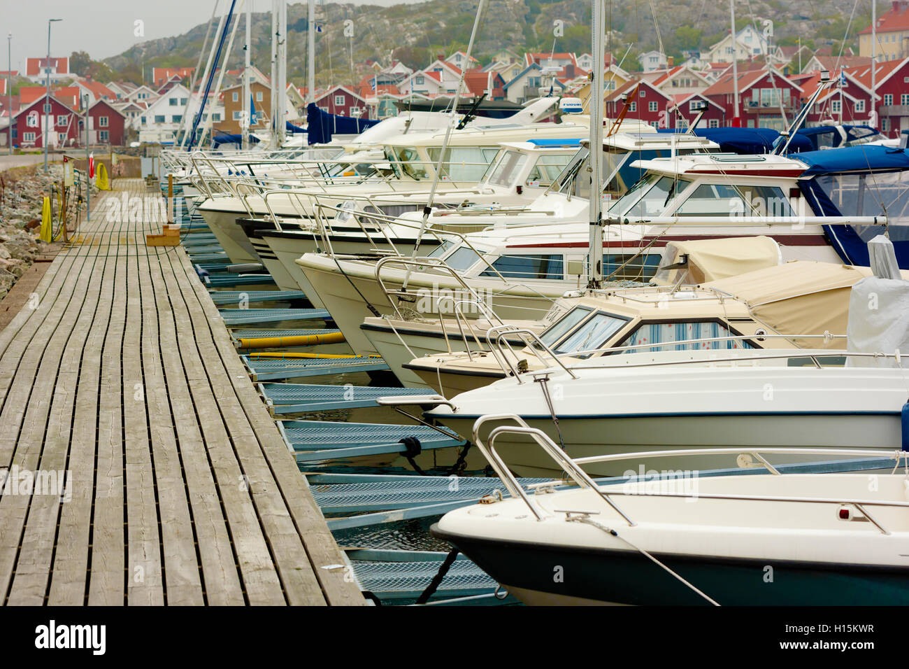 Skarhamn, Sweden - September 9, 2016: Environmental documentary of a pier full of boats in the marina. Part of coastal town in b Stock Photo