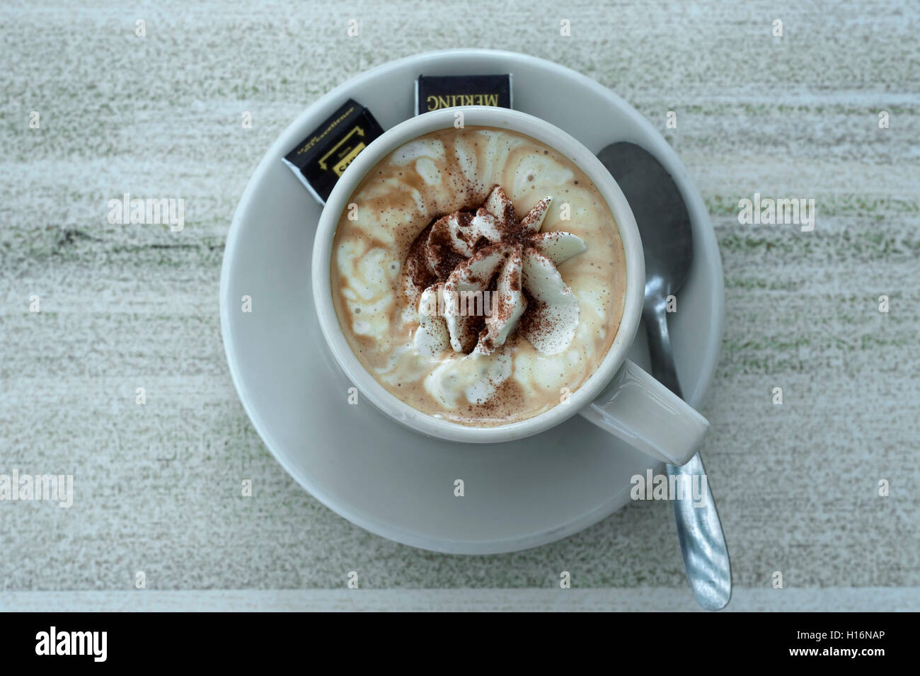 Cappuccino with whipped cream and cocoa powder, France Stock Photo Alamy