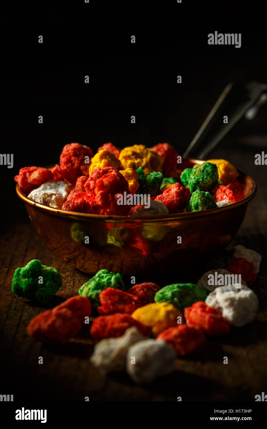 Hazelnut in colorful sugar, sweets in bowl Stock Photo