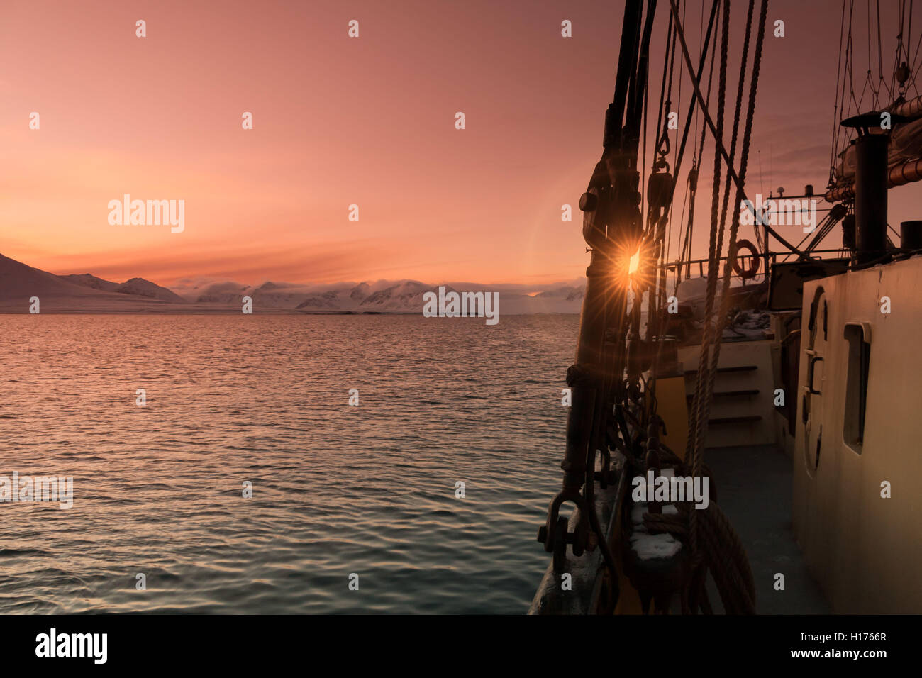 Sailing ship in the evening sun of Svalbard, Spitsbergen. Stock Photo