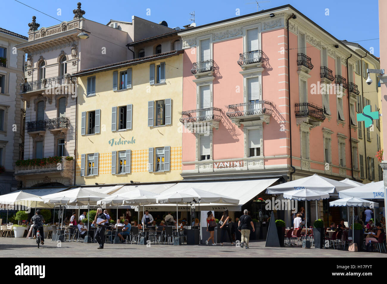 Lugano, Switzerland - 25 august 2016: people eating and drinking at the restaurants in the central square of Lugano on Switzerla Stock Photo