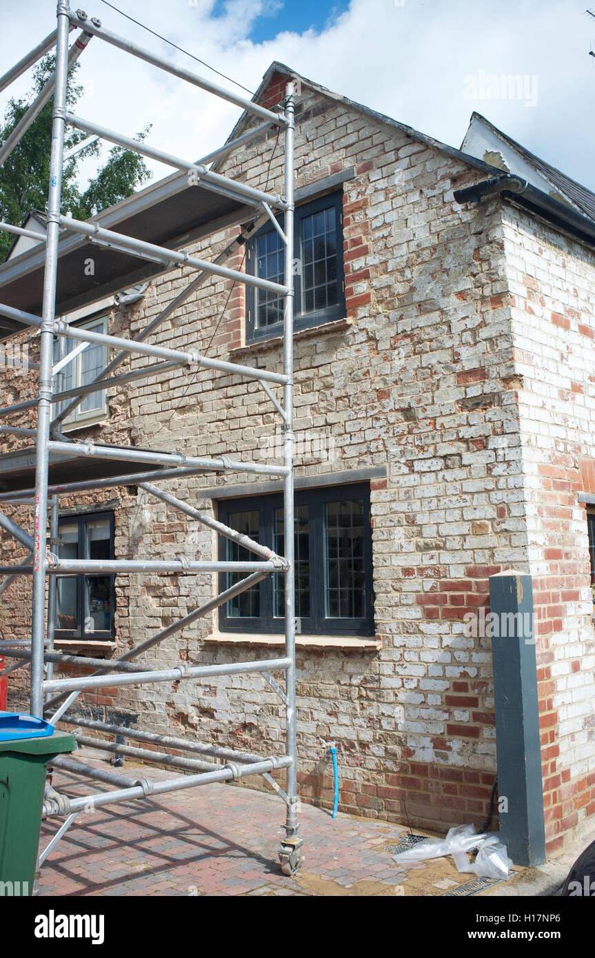 Old house scaffolding renovating hi-res stock photography and images ...
