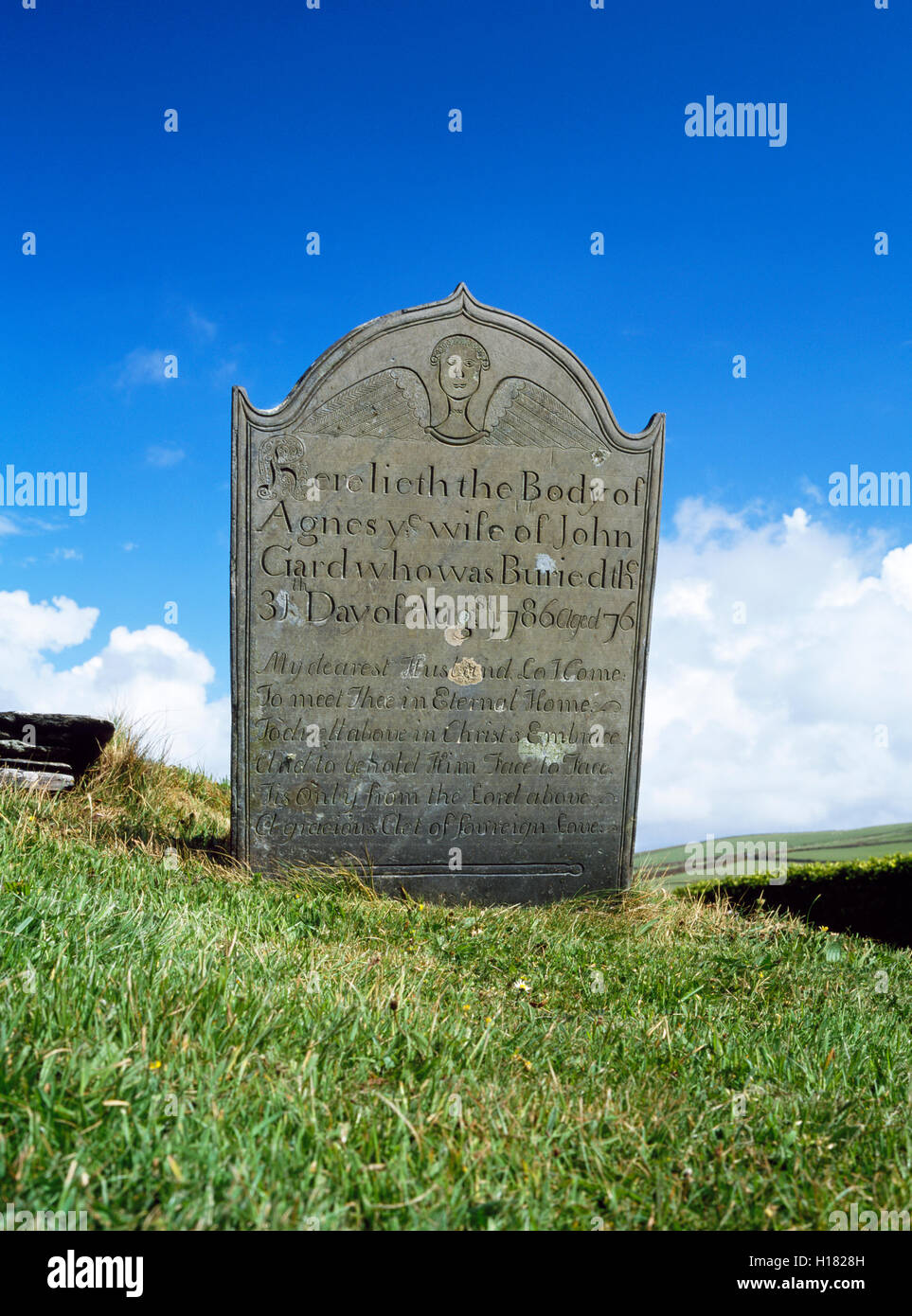 A Georgian headstone, decorated with an angel and epitaph, St Symphorian's church Forrabury, near Boscastle, Cornwall, South West England, UK Stock Photo
