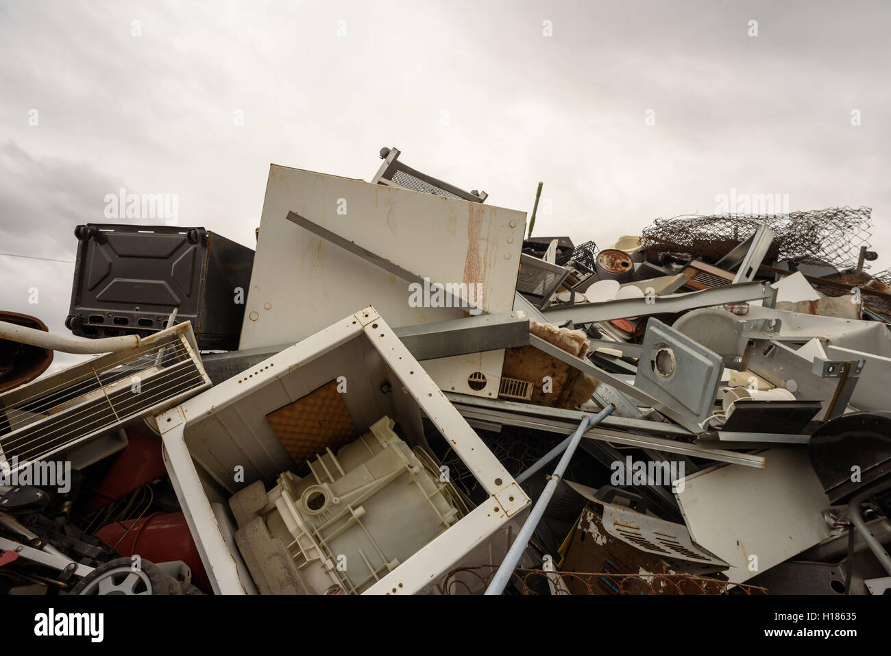 Scrap metal pile with home appliances and white goods collected for