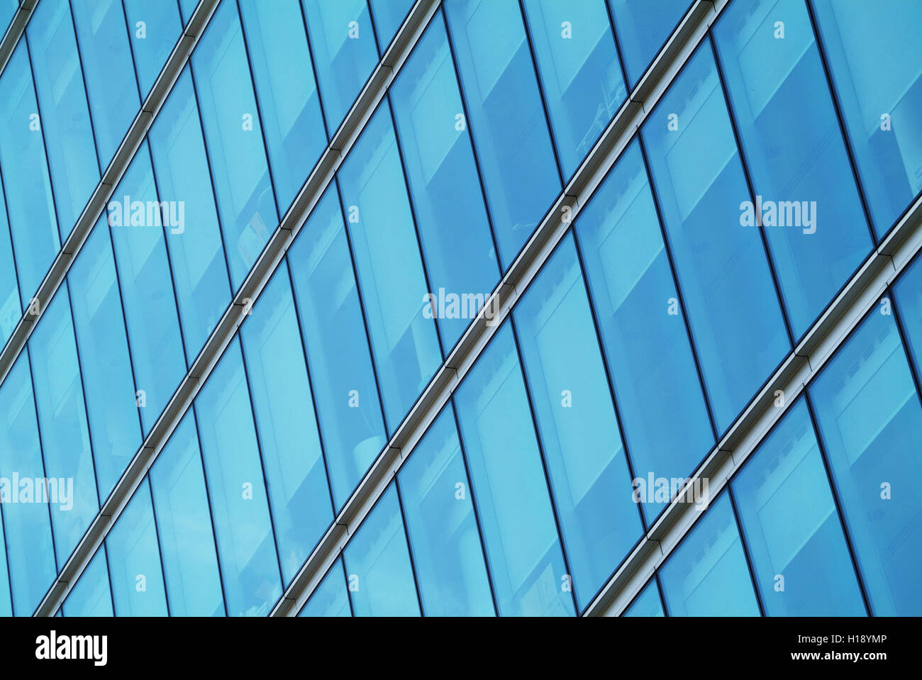 a row of tall windows in an office building Stock Photo - Alamy