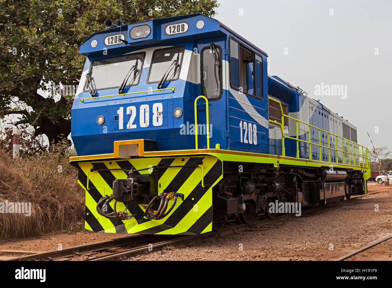 Operations for transporting and managing iron ore. New locomotive added to the fleet used to pull full iron ore wagons from mine to port rail head. Stock Photo