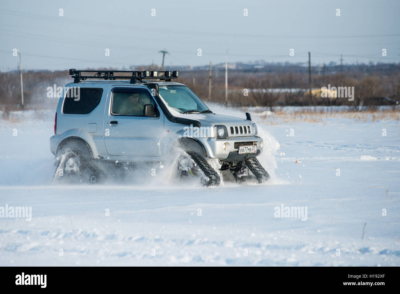 the car rides on tracks in the winter Stock Photo - Alamy