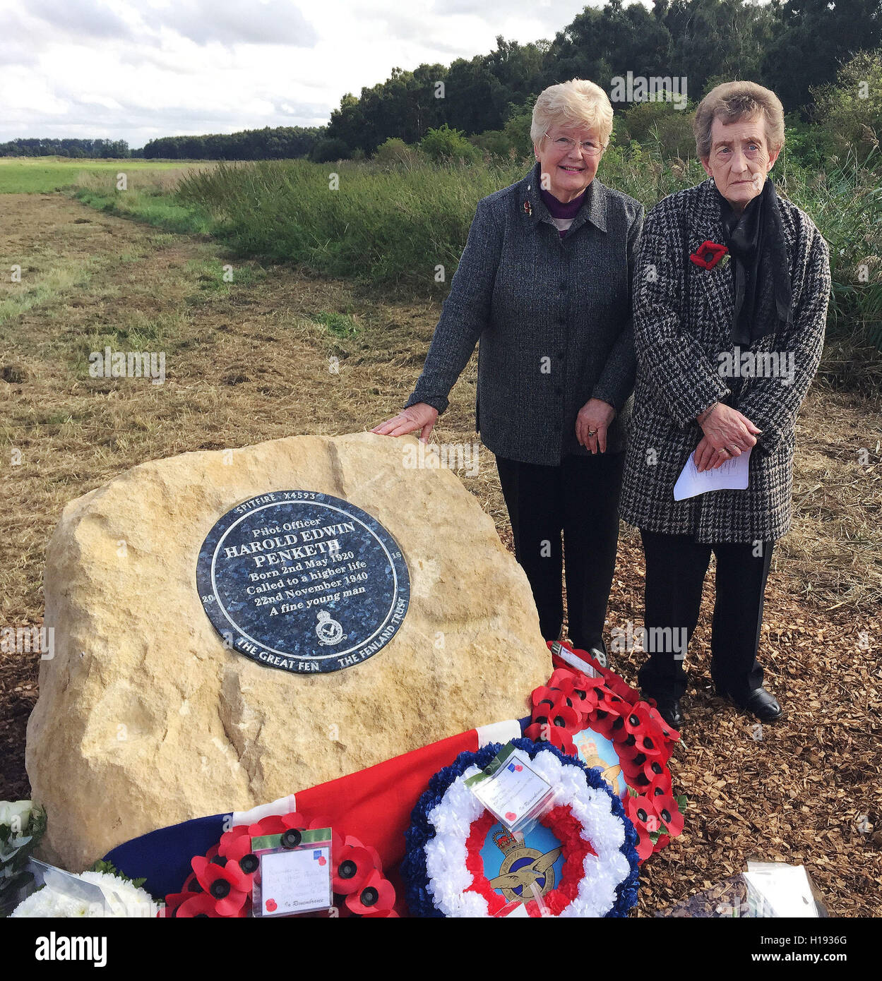 Valetta Cranmer, (left), and Sheila Morris, two first cousins of Spitfire pilot Harold Penketh, unveiled a permanent memorial near the site where his plane was excavated at Holme Lode, the Great Fen, Cambridgeshire. Stock Photo