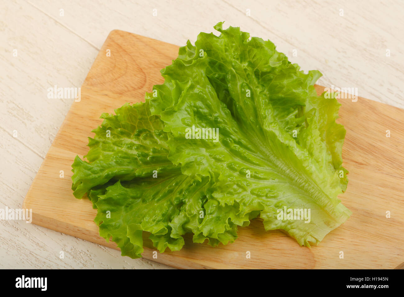 Fresh bright green Salad leaves over wood background Stock Photo Alamy