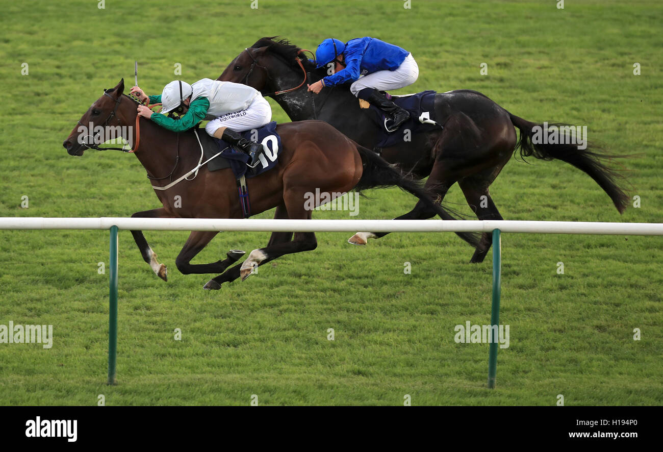 Huntlaw ridden by Joe Fanning (left) before winning the Molson Coors Handicap ahead of Great Order ridden by William Buick during day one of the The Cambridgeshire Meeting at Newmarket Racecourse. Stock Photo