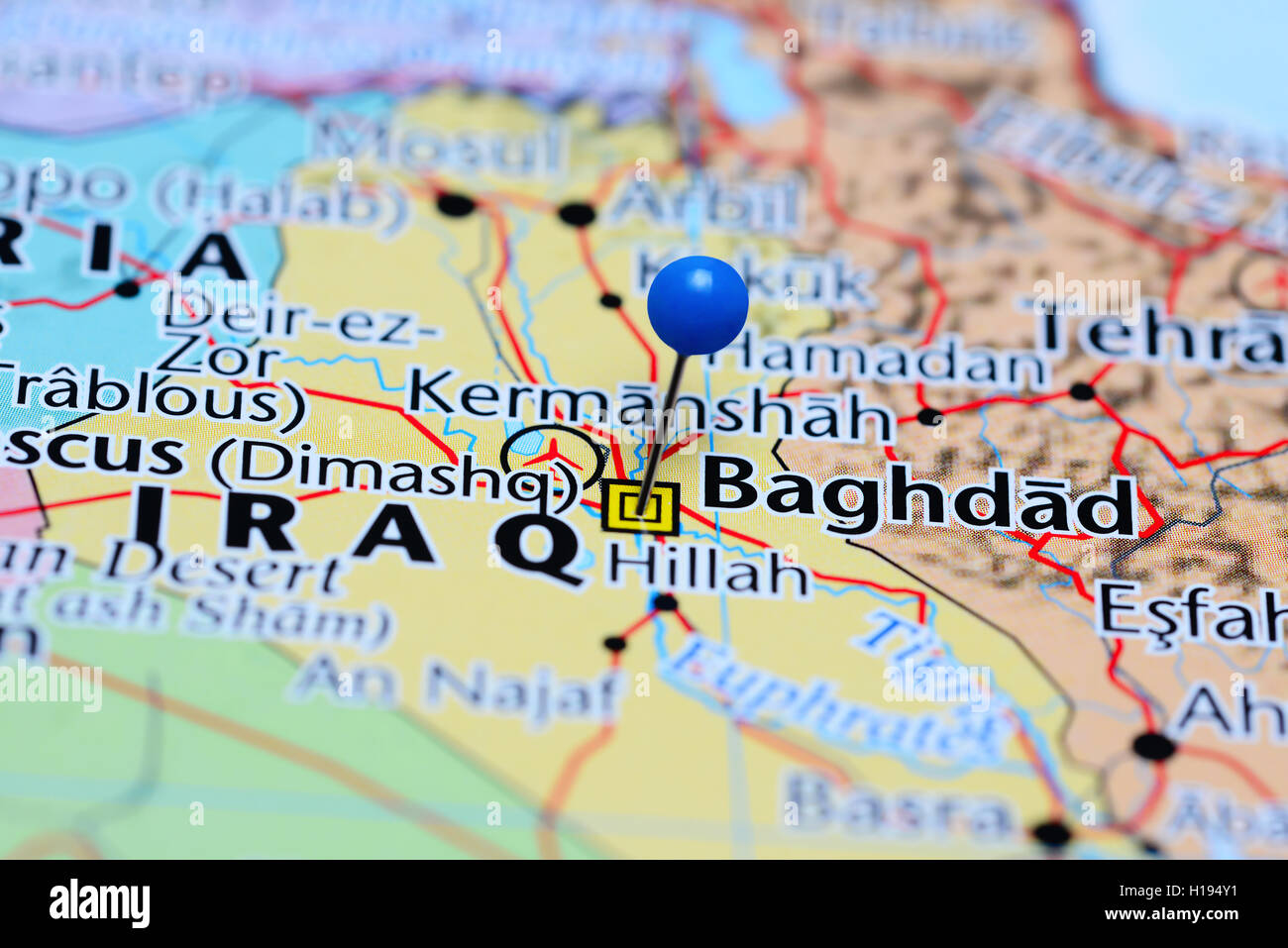 baghdad pinned on a map of iraq stock image