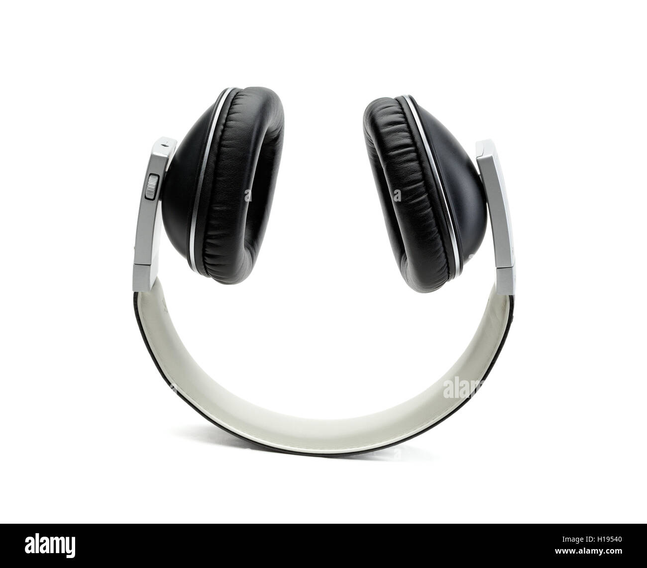 Black leather headphones upside down. Isolate on white background in