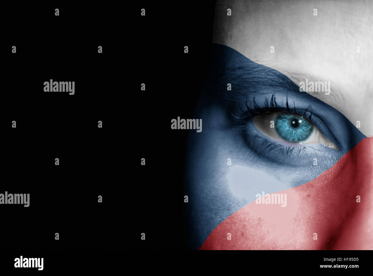 A young female with the flag of Czech Republic painted on her face on her way to a sporting event to show her support. Stock Photo