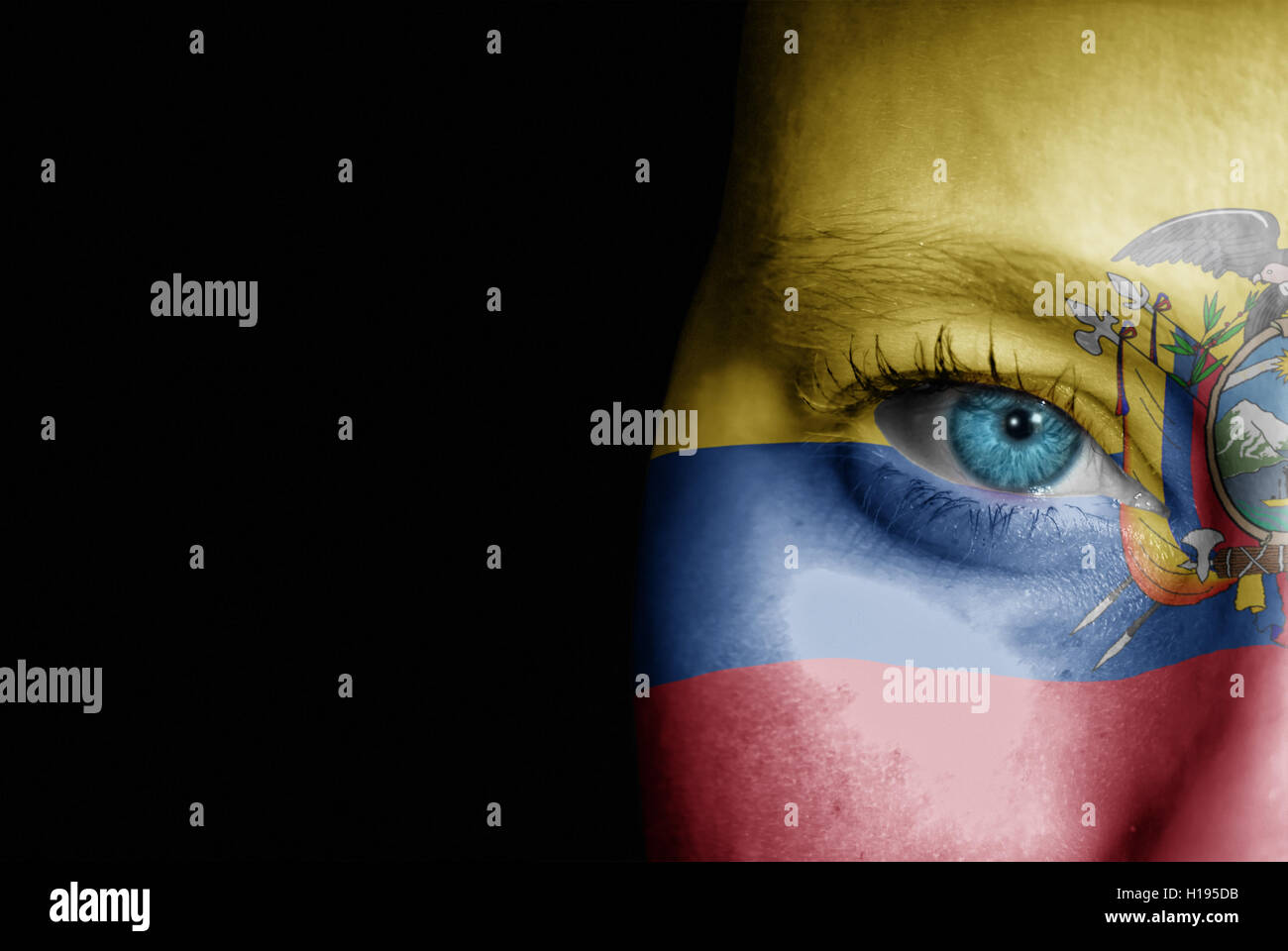 A young female with the flag of Ecuador painted on her face on her way to a sporting event to show her support. Stock Photo