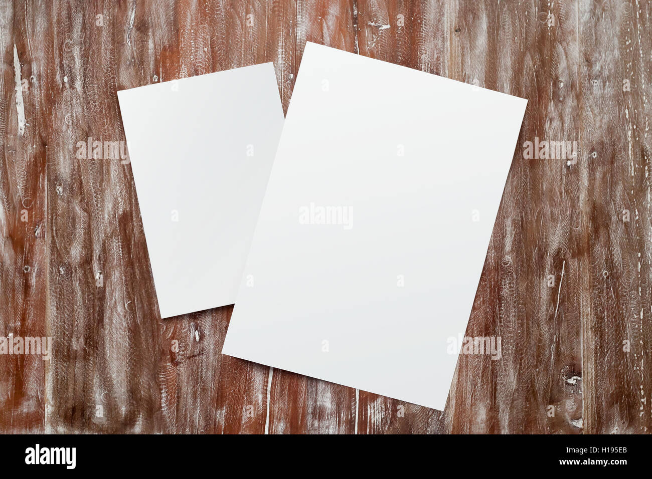 Closeup Two Blank White Paper Sheet Mockup Natural Wood Table Background. Empty Canvas Painted Brown Desk Stock Photo