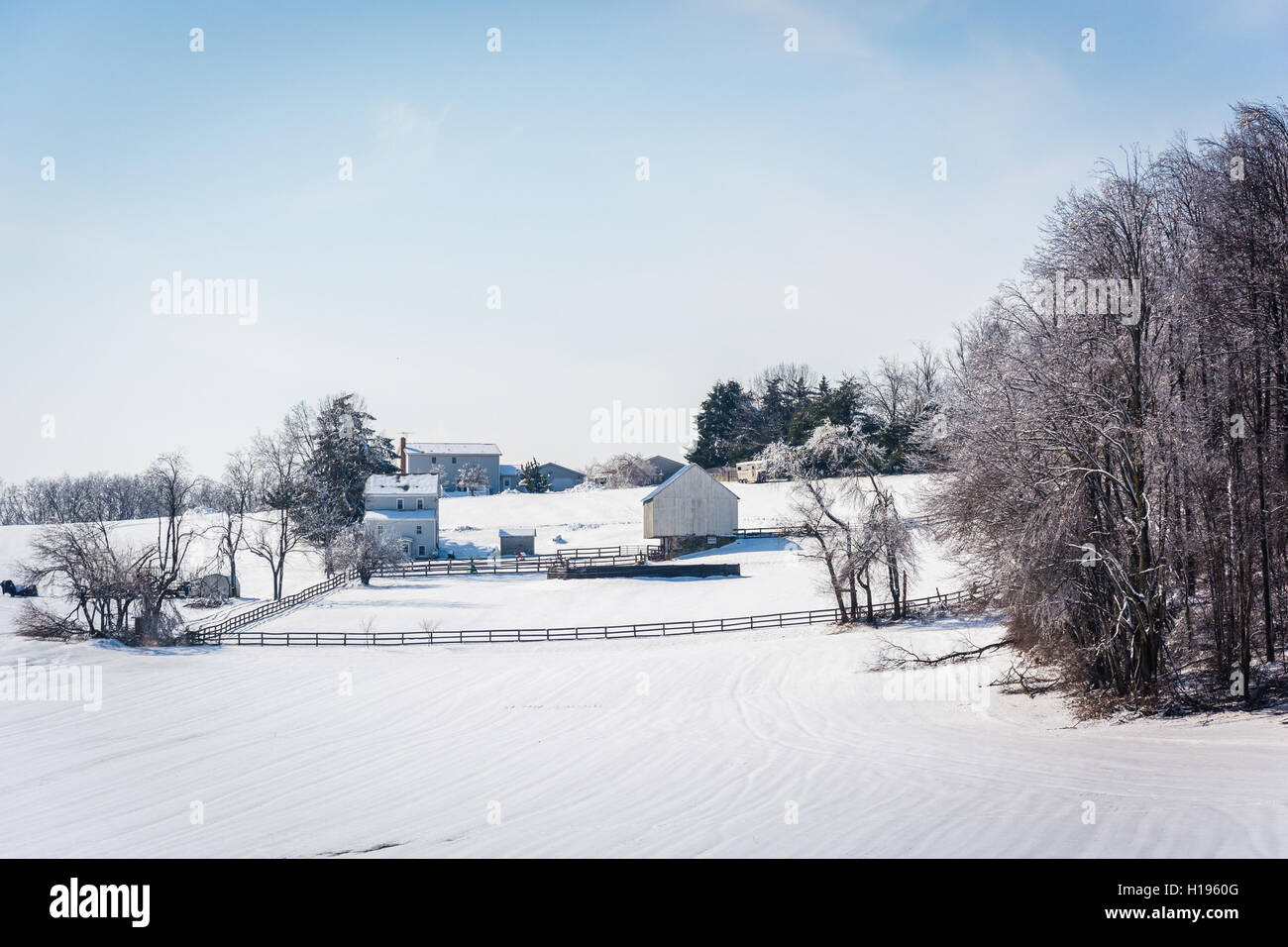Winter view of a snow-covered farm in rural Carroll County, Maryland. Stock Photo