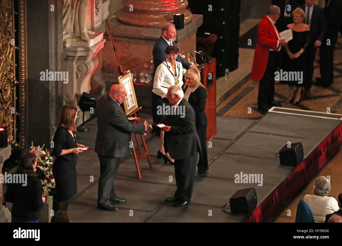 Trevor and Jenni Hicks receive medals on behalf of their daughters Sarah and Vicki, who lost their lives in the Hillsborough disaster, after they were awarded Freedom of the City of Liverpool at a ceremony in Liverpool Town Hall. Stock Photo