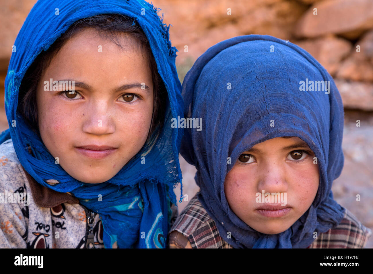 Todra Gorge, Morocco.  Amazigh Berber Sisters, Ages 6 and 9. Stock Photo