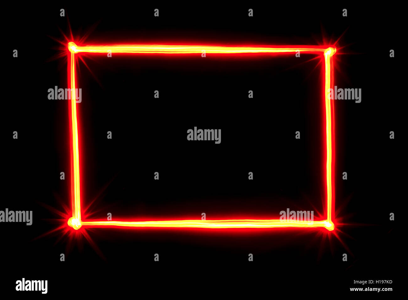 red light painting rectangle frame on black background Stock Photo