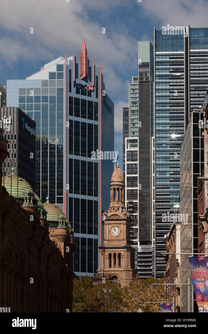 Clock Tower on Sydney Town Hall is installed by the surrounding office and residential towers of George Street Sydney Australia Stock Photo