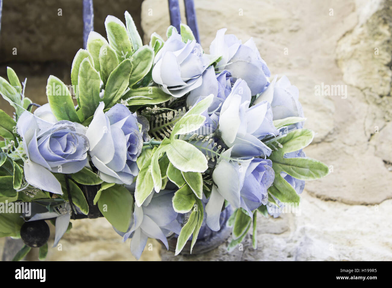 Plastic Blue Roses Blue flowers in bouquet of plastic, nature Stock Photo - Alamy