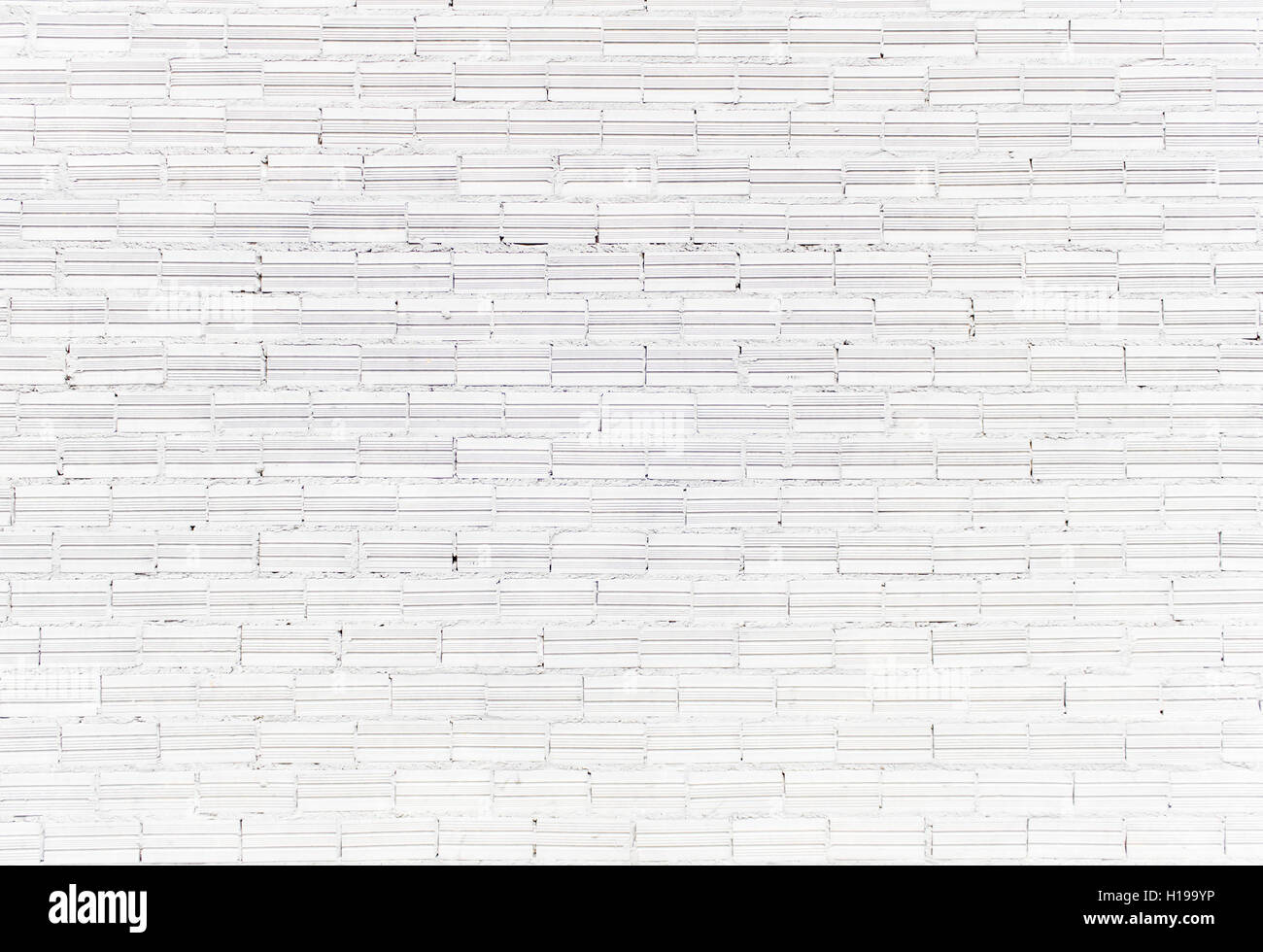Bright white bricks on urban street, construction Stock Photo