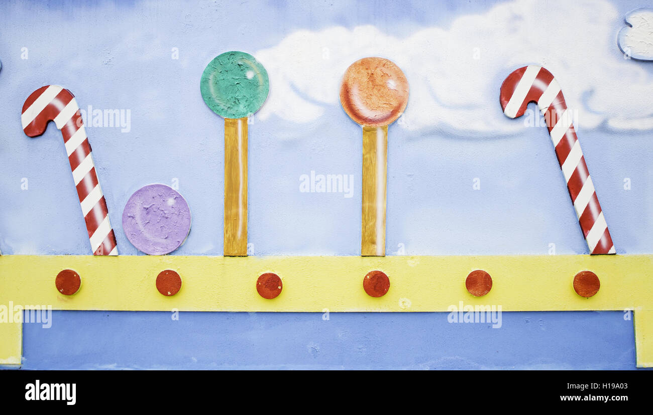 Candy canes and lollipops in urban wall, sweets Stock Photo Alamy