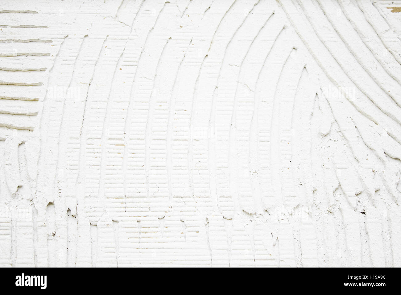 Plaster wall with grooves in urban building, construction Stock Photo