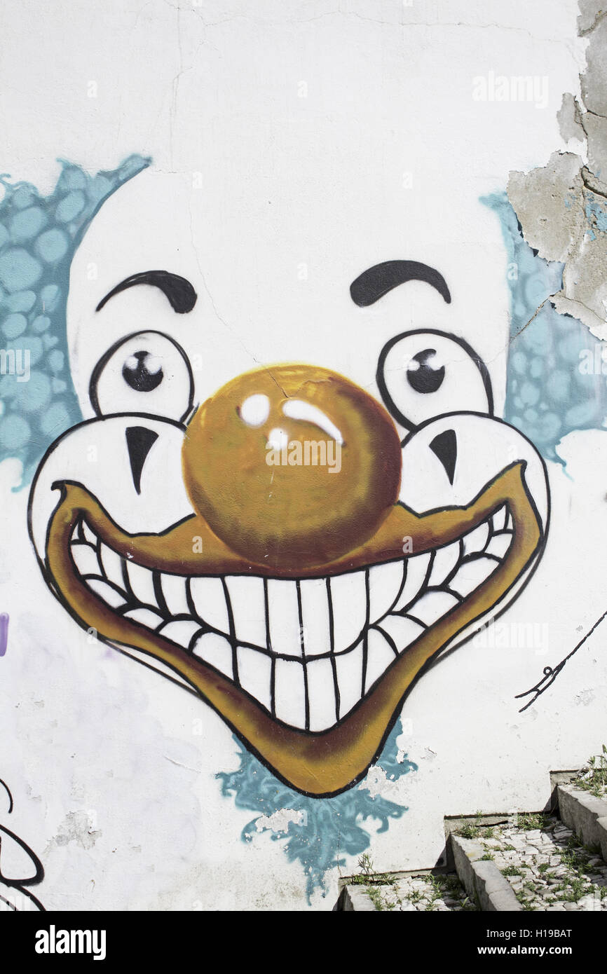 Urban wall smiling clown, circus Stock Photo