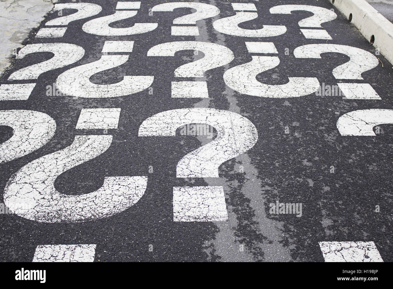 Question marks on urban street, symbol Stock Photo Alamy