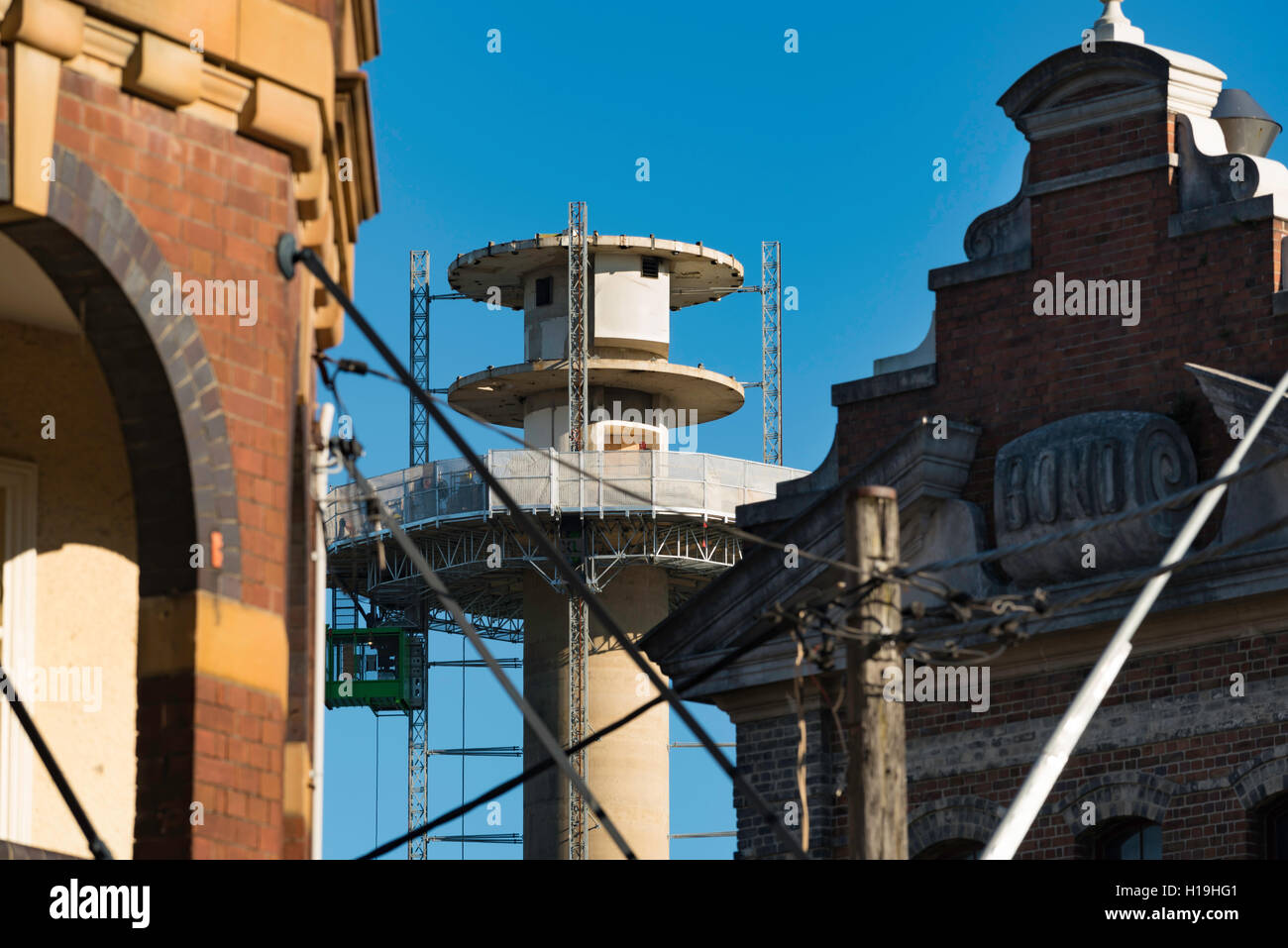 Sydney Ports Authority Tower being progressively demolished is squeezed between two historic buildings in the Rocks, Sydney Stock Photo
