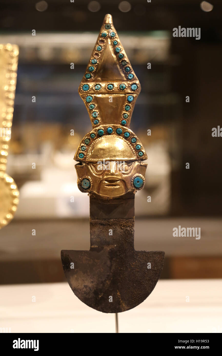 Ceremonial Knife. Peru. Sican (Lambayeque culture). 9th-11th century. Hammered gold and silver turquoise inlay. Stock Photo