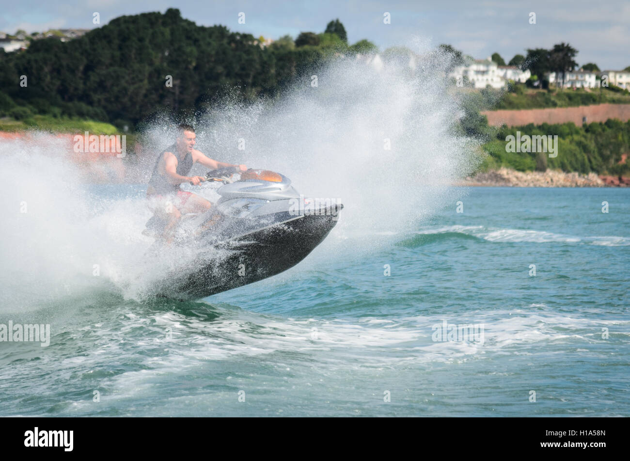 A Jet Ski jumping in Torbay in Devon, England Stock Photo Alamy