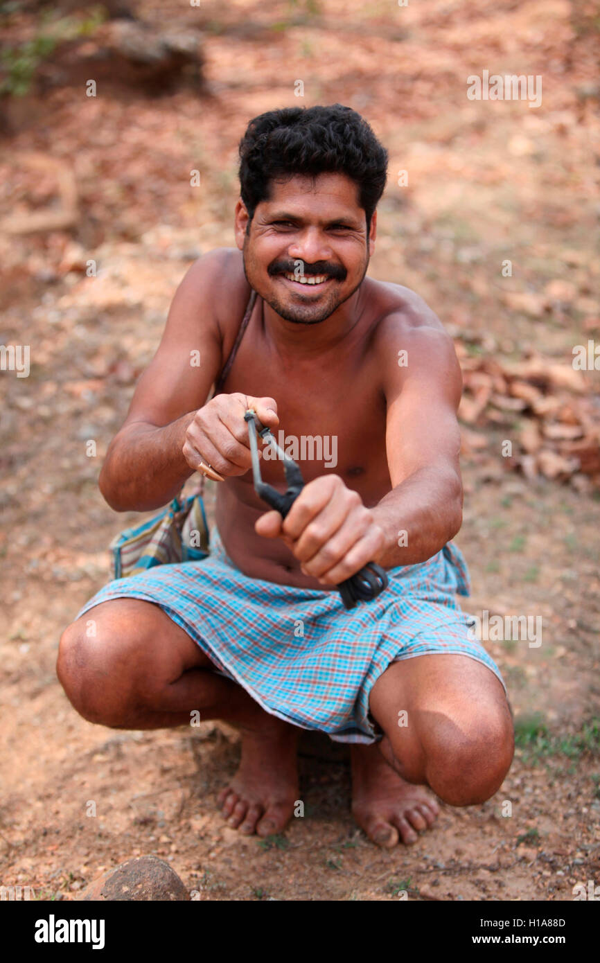Tribal man with Catapult and mud stones, Muria  Tribe, Benur Village, Chattisgarh, India. Rural faces of India Stock Photo