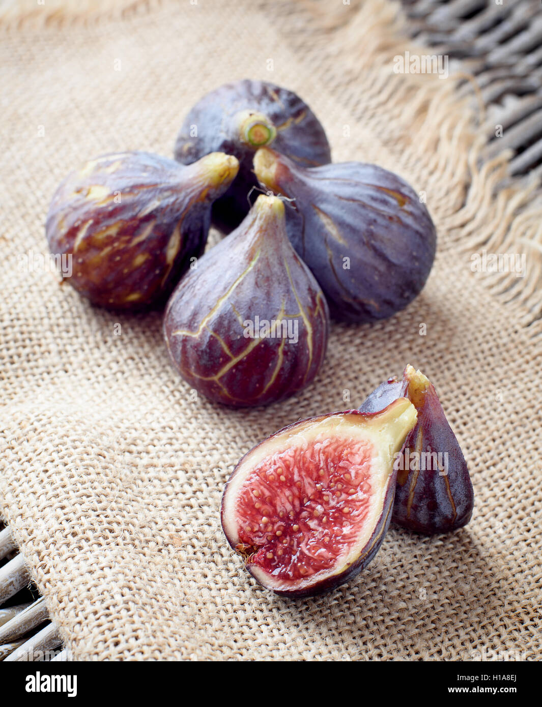 Ripe fruit figson sacking in the studio Stock Photo