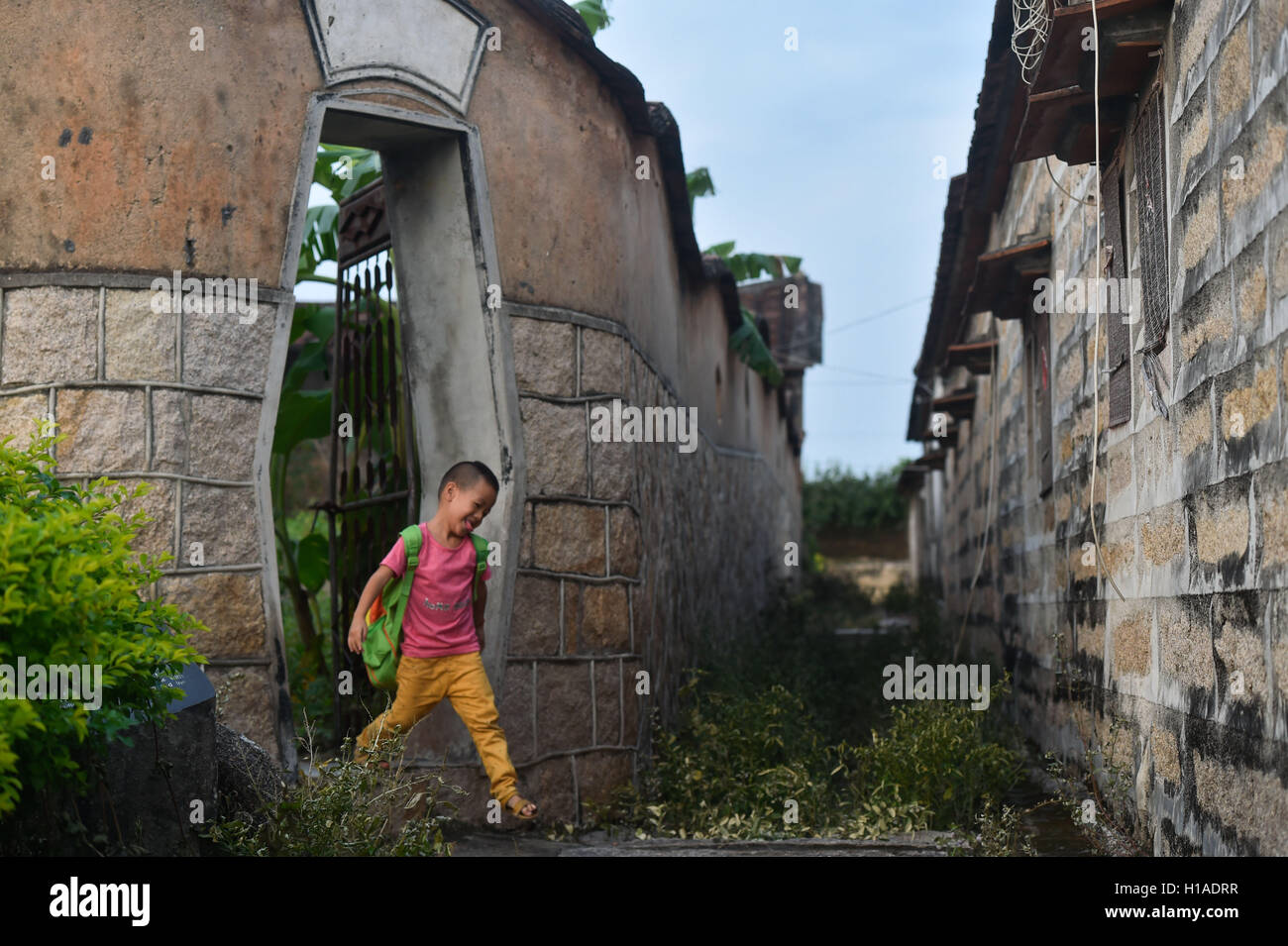 Zhangpu, China's Fujian Province. 22nd Sep, 2016. Four-year-old boy Zhao Botao plays in Zhaojiabao, Zhangpu County, southeast China's Fujian Province, Sept. 22, 2016. Zhaojiabao is a fortress built during the Ming Dynasty (1368-1644) by descendants of the Zhao imperial family of the Northern Song Dynasty (960-1127). It is a copy of the structure of Bianjing City, ancient capital of the Northern Song Dynasty. © Song Weiwei/Xinhua/Alamy Live News Stock Photo