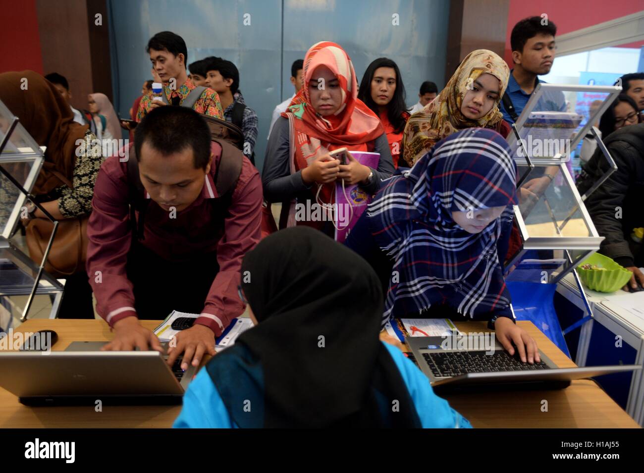 (160923) -- JAKARTA, Sept. 23, 2016 (Xinhua) -- Job seekers fill in online application forms to meet prospective employers at the job fair 2016 in Jakarta, Indonesia, Sept. 23, 2016. (Xinhua/Agung Kuncahya B.) (wtc) Stock Photo