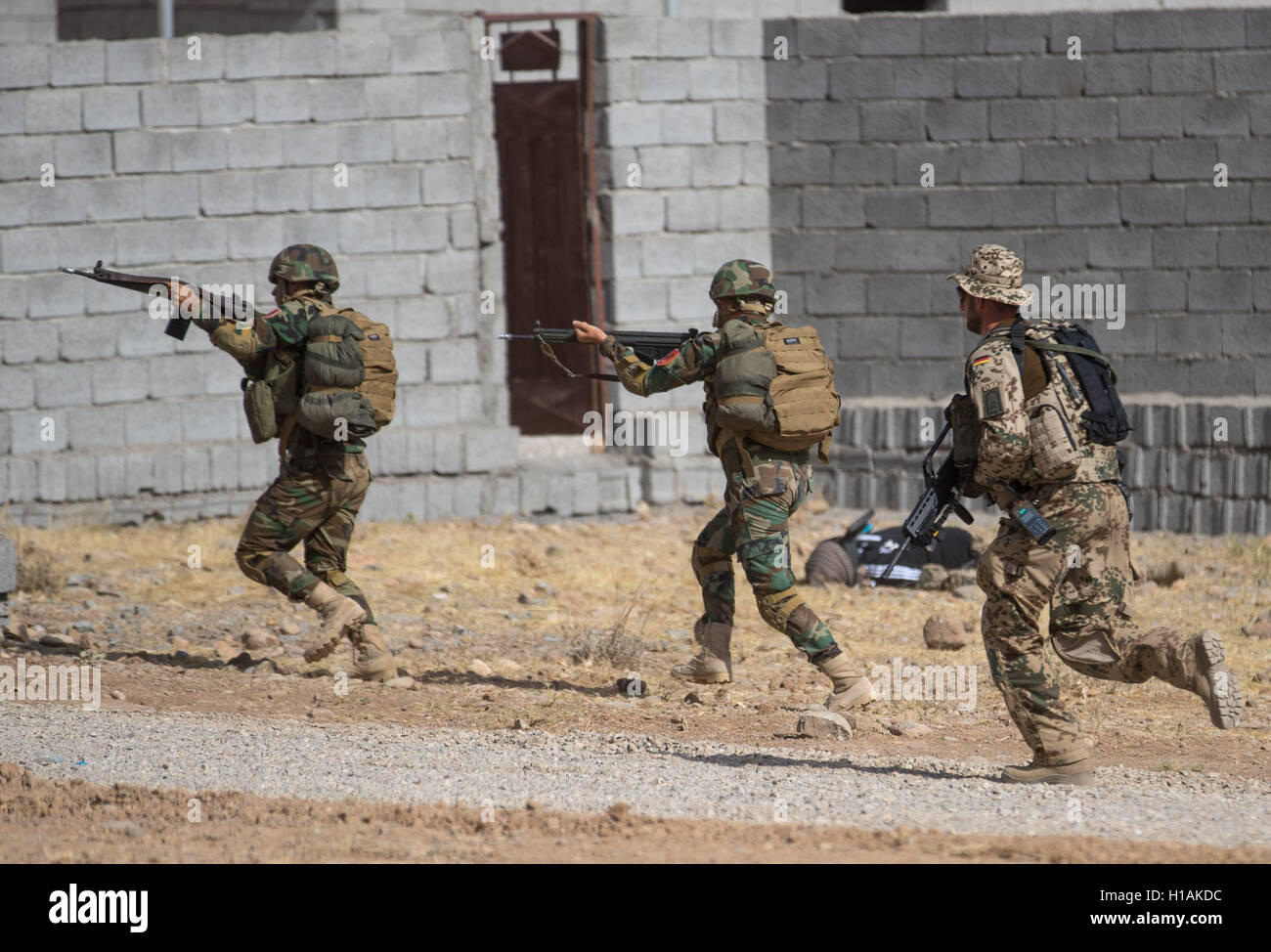 Kurdish Peshmerga soldiers practicing a mission during a visit of ...