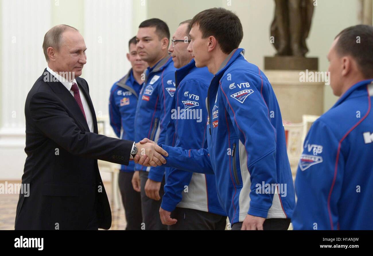 Russian President Vladimir Putin meets with drivers from the KAMAZ road racing team in the Kremlin September 22, 2016 in Moscow, Russia. Putin met with drivers from the winning Kamaz team from the Moscow to Beijing Silk Way Off Road Rally. Stock Photo