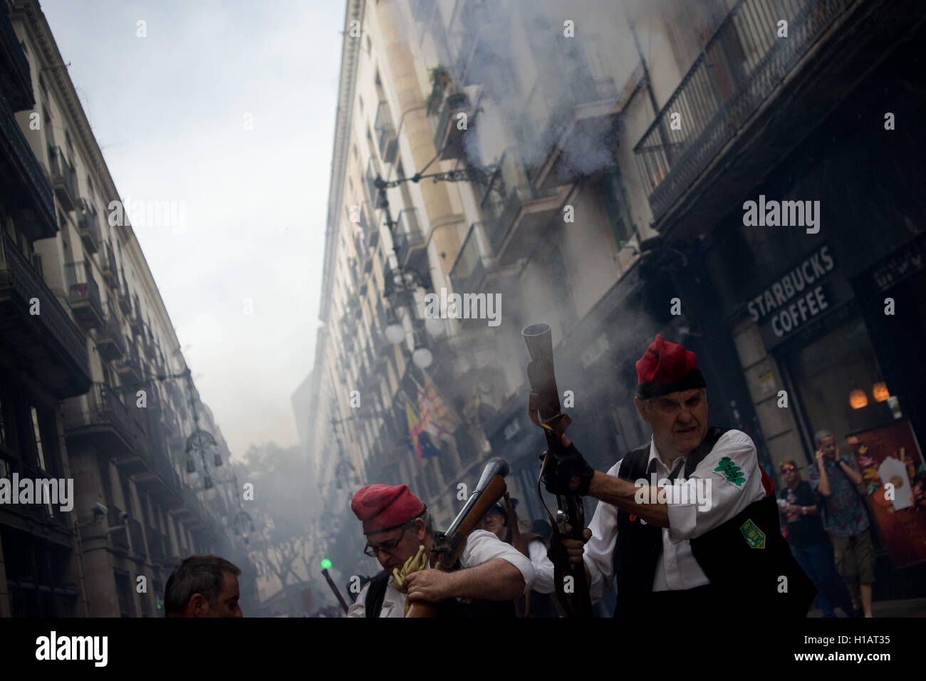 Barcelona, Catalonia, Spain. 24th Sep, 2016. Trabucaires shoot his blunderbuss early in the morning through the streets of Barcelona on the occasion of the celebrations of the Merce Festival (Festes de la Merce). The Galejada Trabucaire marks the beginning of the day of the patron saint of Barcelona, La Merce. Men and women dressed as ancient Catalan bandits take to the streets of the old part of Barcelona and cause a loud noise with his blunderbusses full of gunpowder. © Jordi Boixareu/ZUMA Wire/Alamy Live News Stock Photo