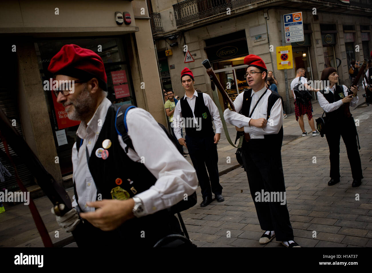 Barcelona, Catalonia, Spain. 24th Sep, 2016. Trabucaires through the streets of Barcelona early in the morning on the occasion of the celebrations of the Merce Festival (Festes de la Merce). The Galejada Trabucaire marks the beginning of the day of the patron saint of Barcelona, La Merce. Men and women dressed as ancient Catalan bandits take to the streets of the old part of Barcelona and cause a loud noise with his blunderbusses full of gunpowder. © Jordi Boixareu/ZUMA Wire/Alamy Live News Stock Photo