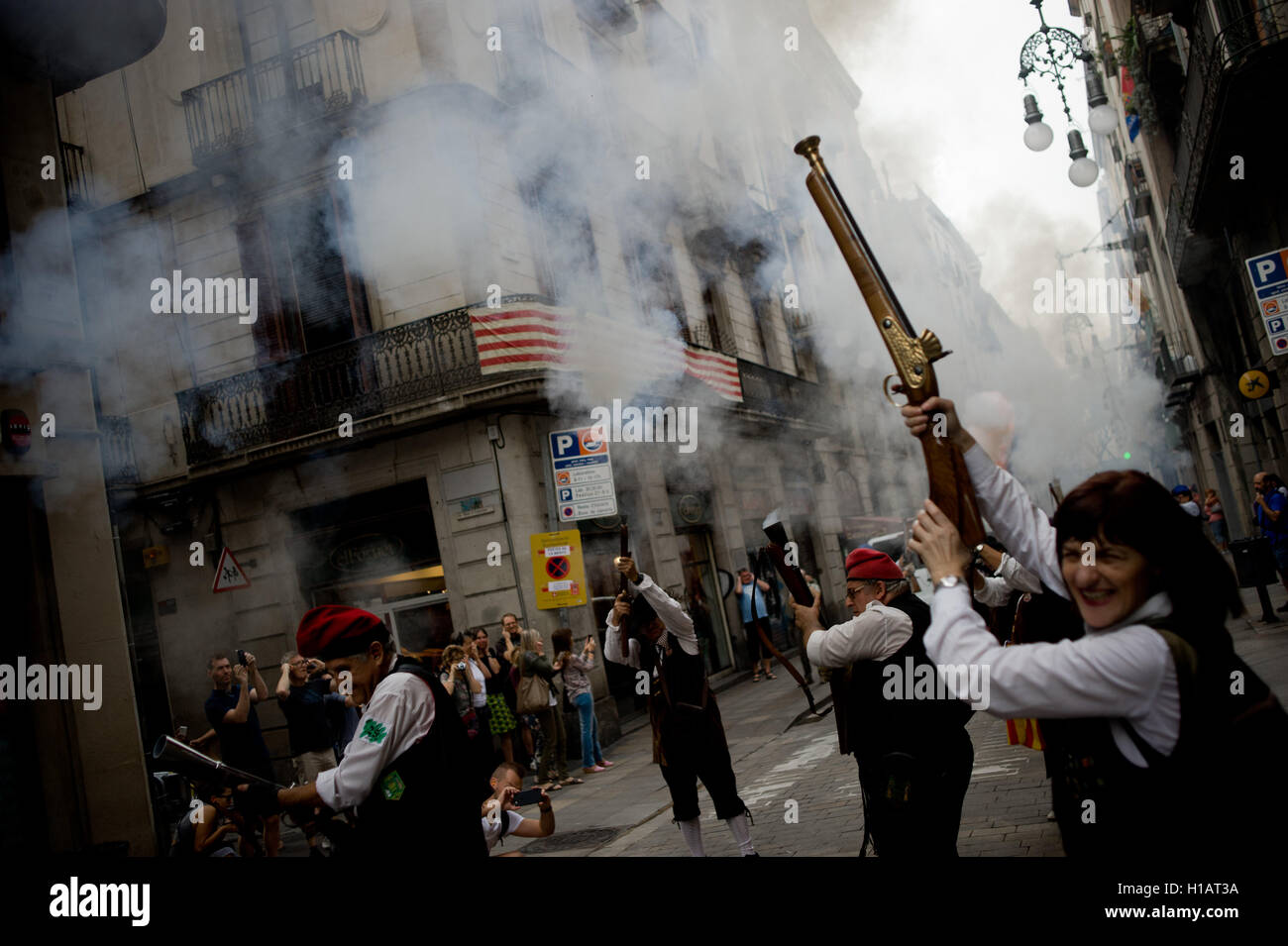 Barcelona, Catalonia, Spain. 24th Sep, 2016. Trabucaires shoot his blunderbuss early in the morning through the streets of Barcelona on the occasion of the celebrations of the Merce Festival (Festes de la Merce). The Galejada Trabucaire marks the beginning of the day of the patron saint of Barcelona, La Merce. Men and women dressed as ancient Catalan bandits take to the streets of the old part of Barcelona and cause a loud noise with his blunderbusses full of gunpowder. © Jordi Boixareu/ZUMA Wire/Alamy Live News Stock Photo