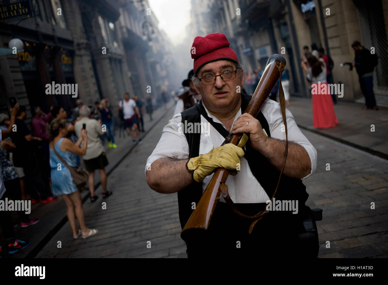 Barcelona, Catalonia, Spain. 24th Sep, 2016. A trabucaire through the streets of Barcelona early in the morning on the occasion of the celebrations of the Merce Festival (Festes de la Merce). The Galejada Trabucaire marks the beginning of the day of the patron saint of Barcelona, La Merce. Men and women dressed as ancient Catalan bandits take to the streets of the old part of Barcelona and cause a loud noise with his blunderbusses full of gunpowder. © Jordi Boixareu/ZUMA Wire/Alamy Live News Stock Photo