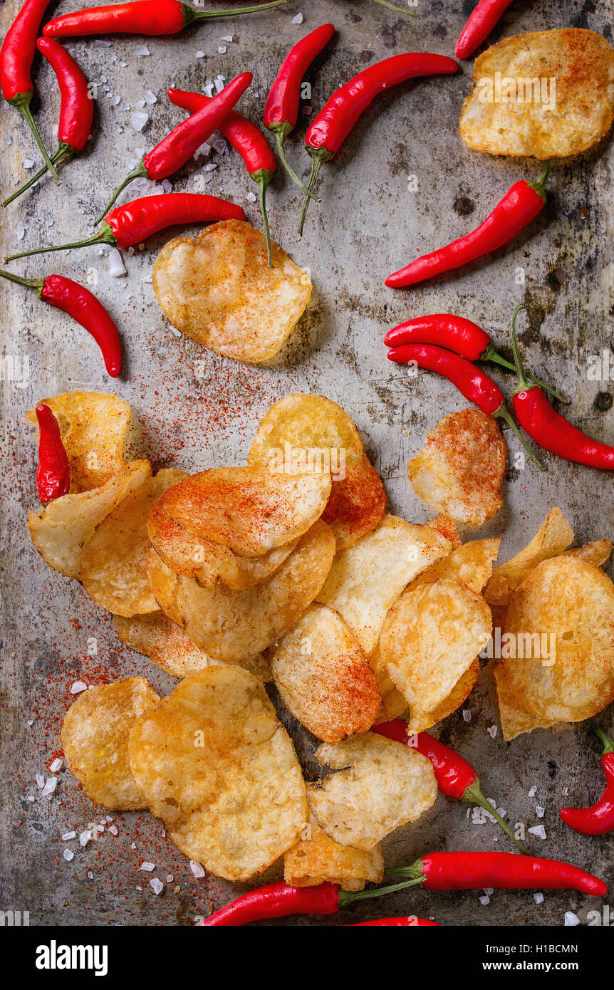 Potatoes chips with chili peppers Stock Photo