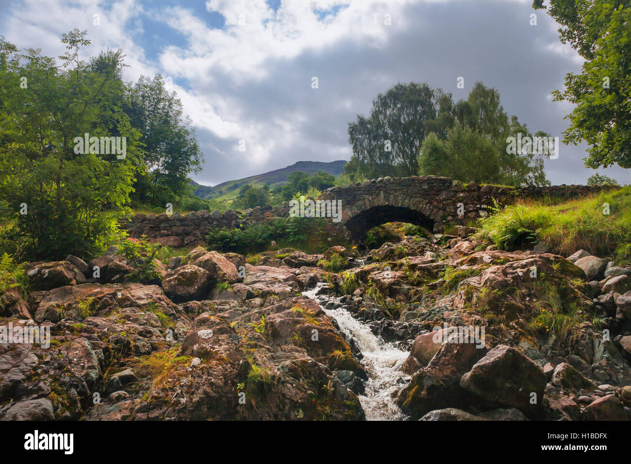 Ashness Bridge over Barrow Beck, Borrowdale, Lake District, Cumbria Stock Photo