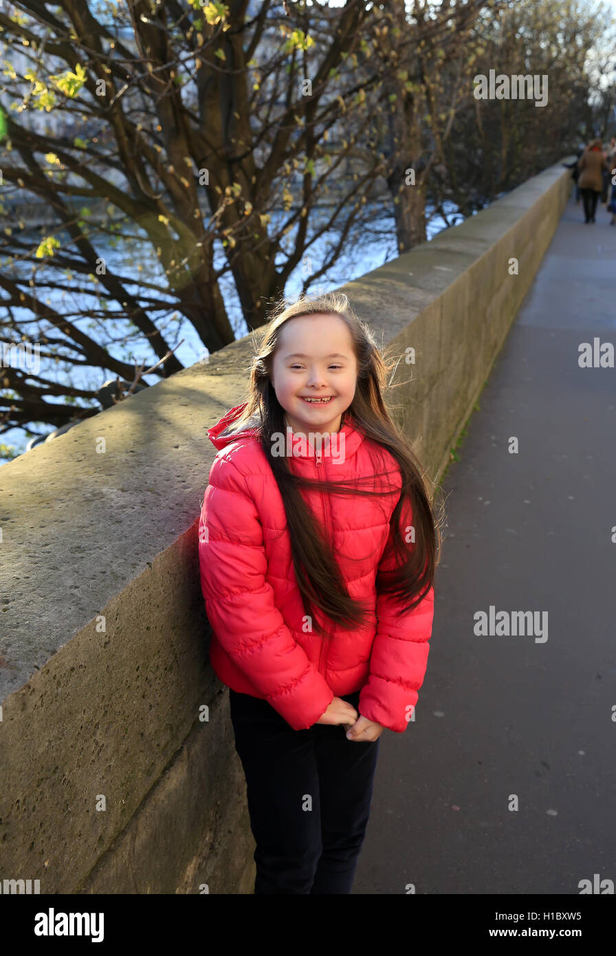 Portrait of little girl smiling outside Stock Photo - Alamy