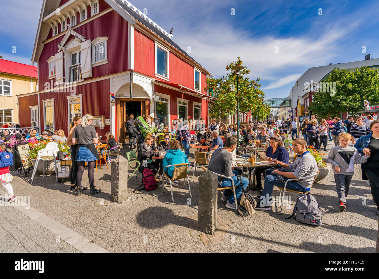 People at a cafe outdoors during Menningarnott-Cultural Festival in Reykjavik, Iceland Stock Photo